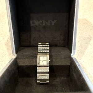 DKNY bracelet watch, EUC Rhinestone silver analog watch with box & info insert